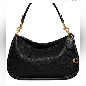 Timeless and versatile, the Soft Pebble Leather Cary Crossbody by COACH